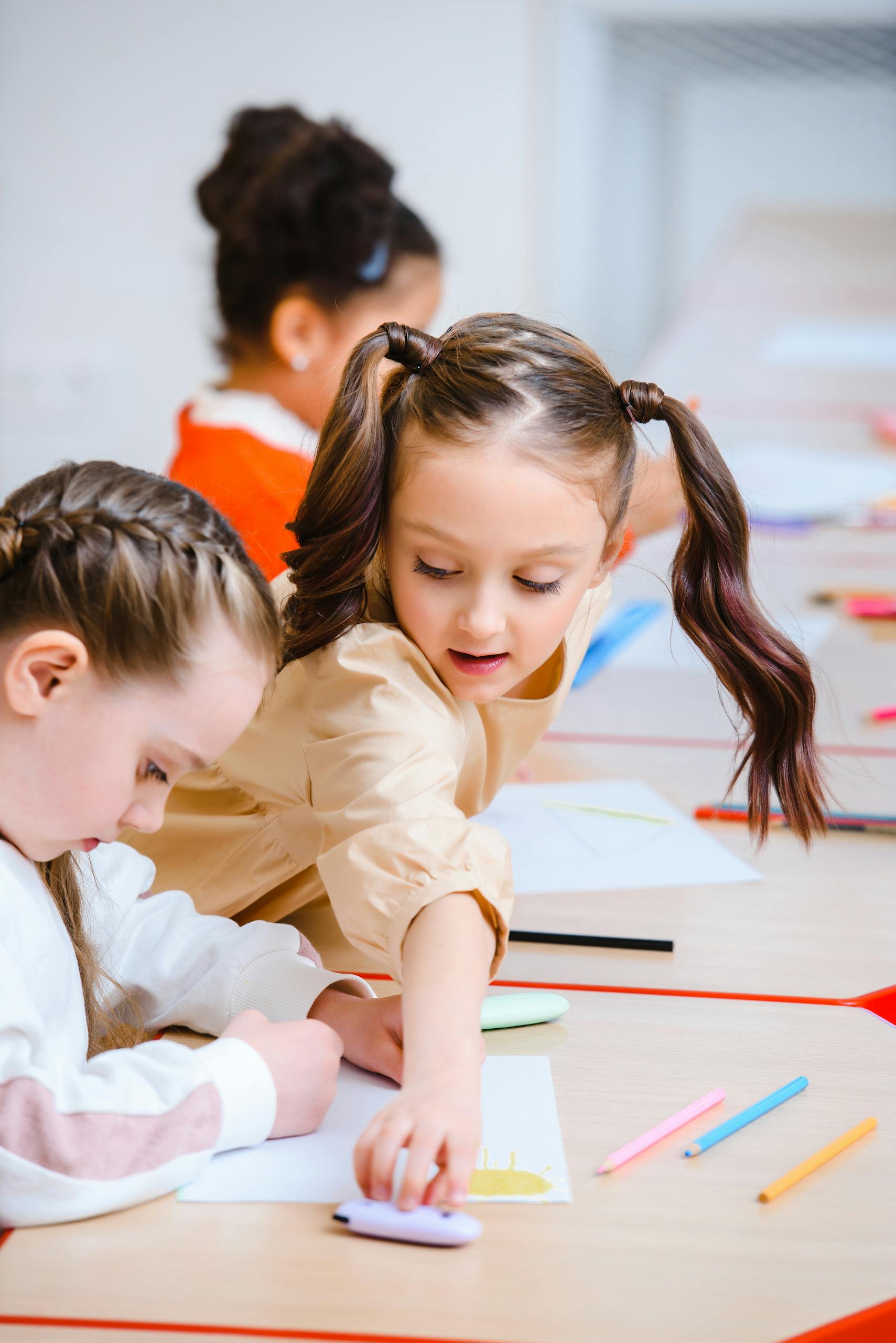 Children engaged in drawing activities at school, showcasing creativity and learning.